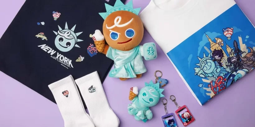 cookierun-nyc-pop-up-shop_jpg_820 | Map Bussid Terbaru Plush Statue of Liberty–inspired toy with ice cream cone, surrounded by white socks, a navy tote bag, and colorful keychains on a purple background.