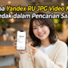 Smiling woman in a café holds up a smartphone displaying the Yandex RU app; bold Indonesian headline overlays the scene.