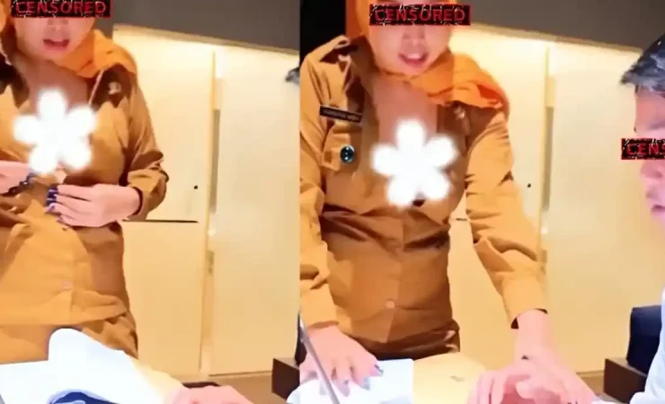 Two people in tan uniforms stand at a desk with papers; faces are censored and a white flower graphic covers a chest area on one person.