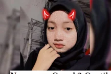 Portrait of a young woman in a black hijab with a red devil-horn filter; caption reads 'Nomor wa Cewek2 Cantik'.