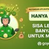 GoJek promo banner with a green-clad rider, large 8% text, coins and money bag on a green background and the GoJek logo (informational ad).